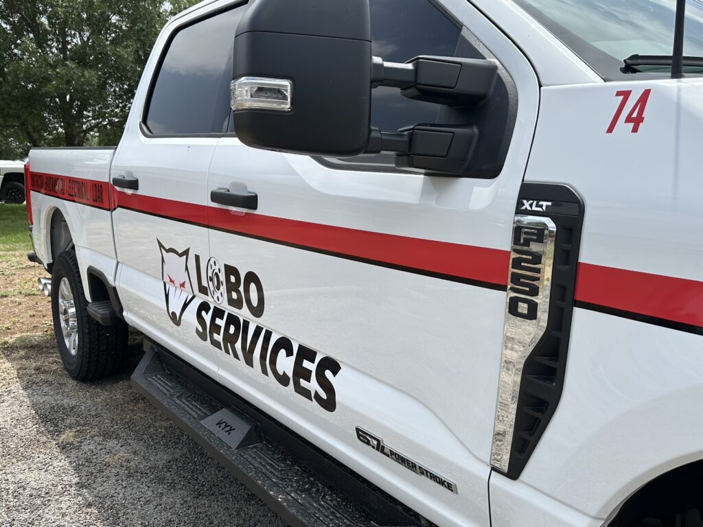 Pickup with business information decals on side